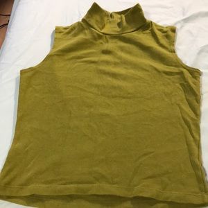 Green sleeveless turtleneck.